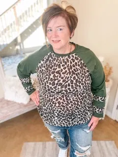 Last Chance Size 3XL | Earning Your Spots Leopard Long Sleeve Top with Color Block Sleeves in Olive Green